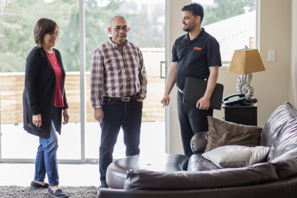 Ferguson Move Manager meeting with a couple to discuss their upcoming move.