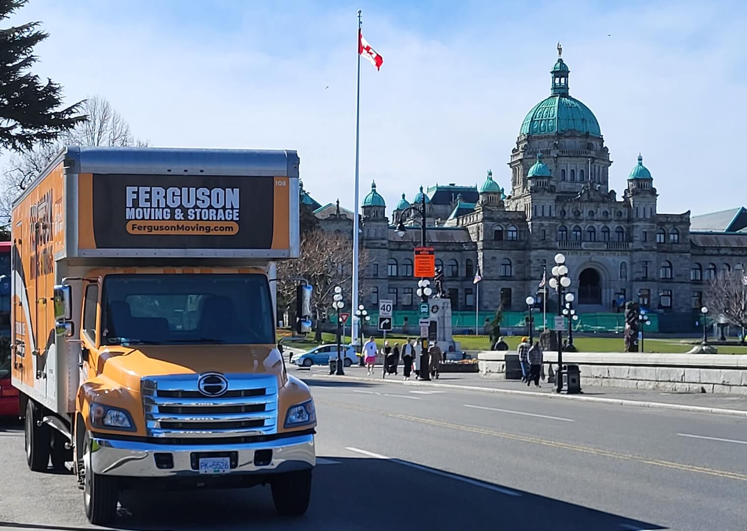 Victoria movers with Ferguson moving truck at Parliament building.
