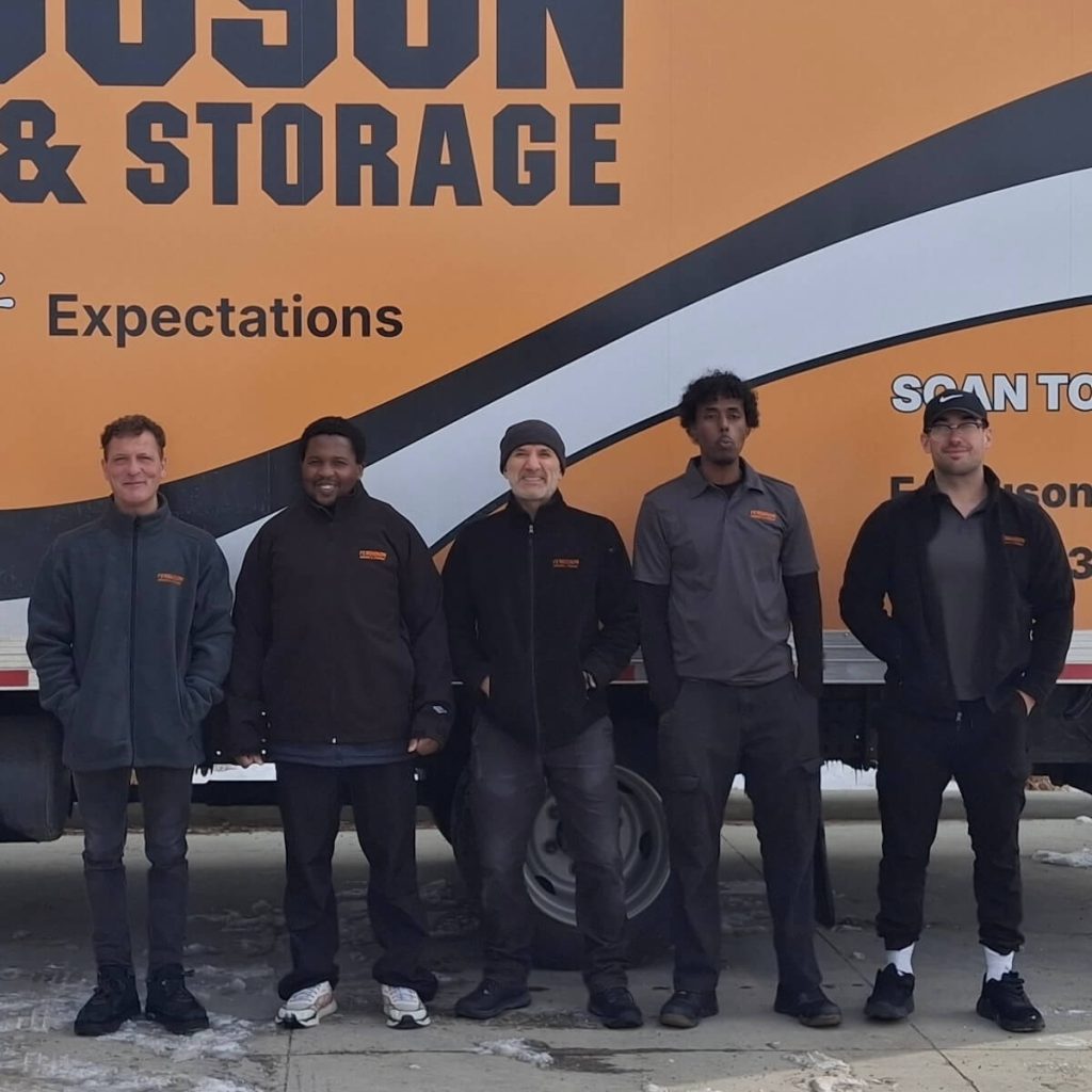 Ferguson Calgary movers standing in front of moving truck.