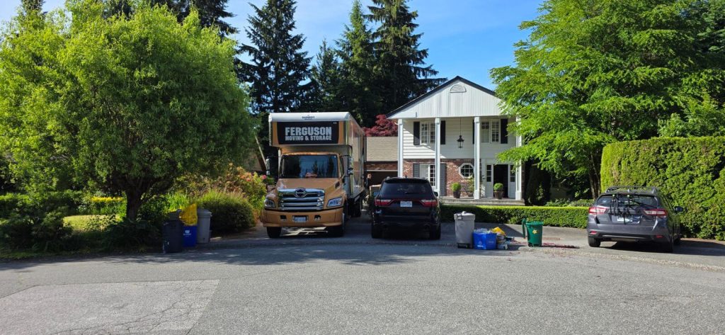 Ferguson moving truck parked in front of a house during a West Vancouver move.