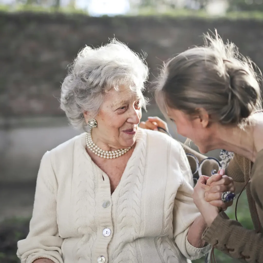 Senior talkiing to their daughter,