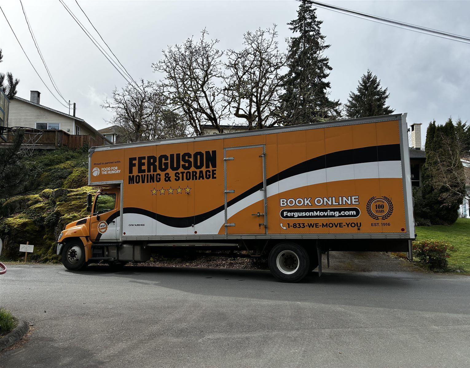 Ferguson Moving & Storage moving truck on a residential street in Victoria.