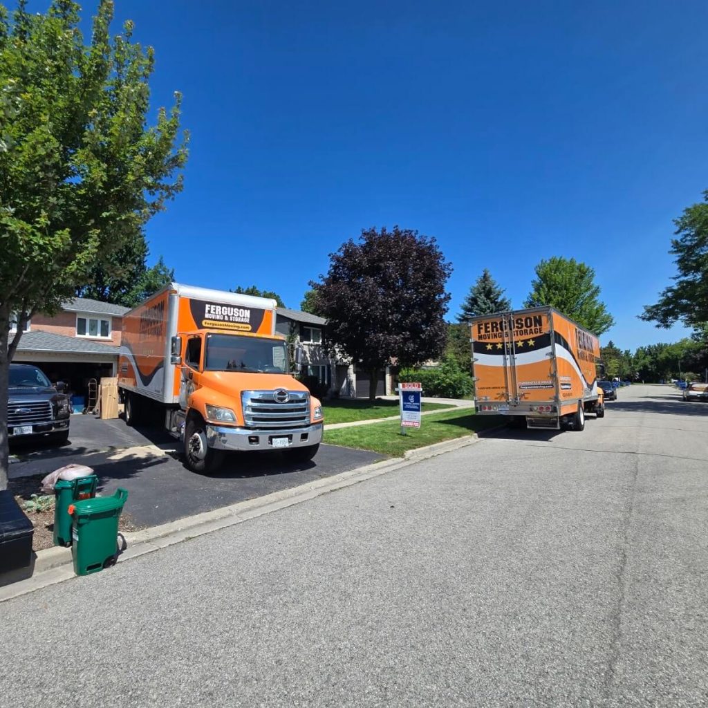 Looking out the front door toward the back of a loaded truck, its ramp lowered to the walkway