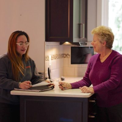 Ferguson Moving & Storage team member helping a senior client prepare for her move.